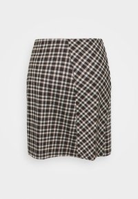 Vävt rutigt kjol i svart, vitt och brunt. A-linjeform med en subtil inslagning och en fåll som sitter ovanför knät.