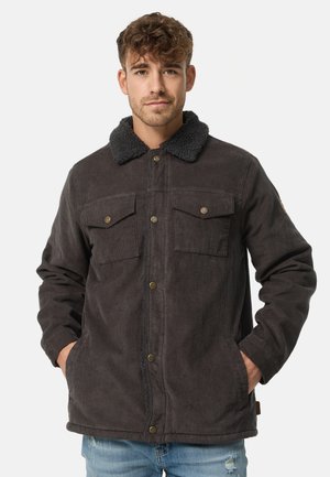 Donker corduroy jacket met een schapenvachtkraag, twee borstzakken en een knoopsluiting. Gelaagd stof met een stevige ontwerpm.