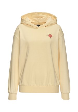 Pale yellow hoodie with elastic cuffs and hem, small red circle graphic with "Saint Tropez" text on the upper left chest.