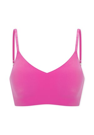Soutien-gorge sans couture rose vif avec fines bretelles réglables et design lisse légèrement rembourré.