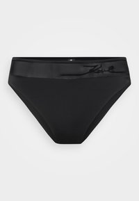 Melna bikini apakša ar gludu, matētu tekstūru. Ar satīna jostu, kurai priekšpusē ir smalka iepresēta logo. Klasisks dizains.