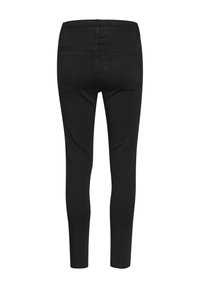 Schwarze enge Jeans aus dehnbarem Stoff mit mittelhoher Taille, Gesäßtaschen und sauberem Nähen entlang der Nähte.