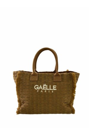 Borsa tote marrone con trama, manici corti e bordi frangiati, con il logo bianco "GAËLE PARIS" centrato sul davanti.