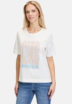 White cotton T-shirt with short sleeves featuring a textured "CIAO" graphic in pastel colors and a relaxed fit design.