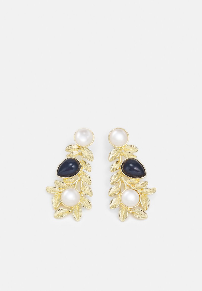 Gold-tone leaf-shaped earrings featuring three stones: a white pearl, a black stone, and a larger white pearl, with textured leaves.