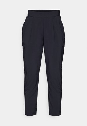 Black tapered pants with a wide, elastic waistband, front pleats, and side pockets. Made from a smooth, lightweight fabric.
