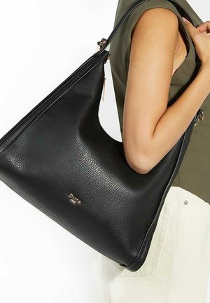 Black leather handbag with a smooth texture, slouchy hobo design, and gold hardware accents. Large opening for easy access.