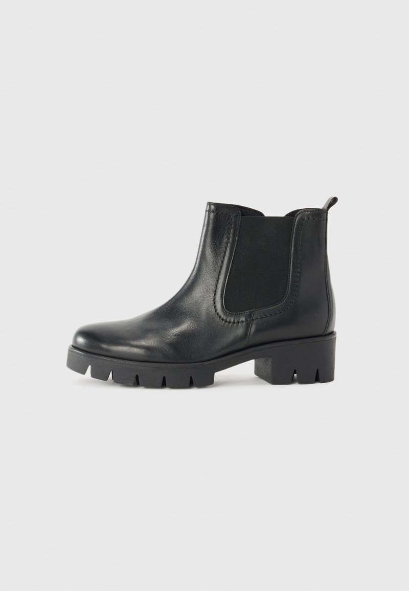 Schwarzer Lederknöchelstiefel mit elastischen seitlichen Einsätzen, runder Spitze und dickem Gummisohle mit ausgeprägtem Profil. Minimalistisches Design und glatte Textur.
