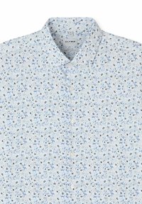 White button-up shirt with small blue and black floral patterns, spread collar, and visible brand label inside the collar.