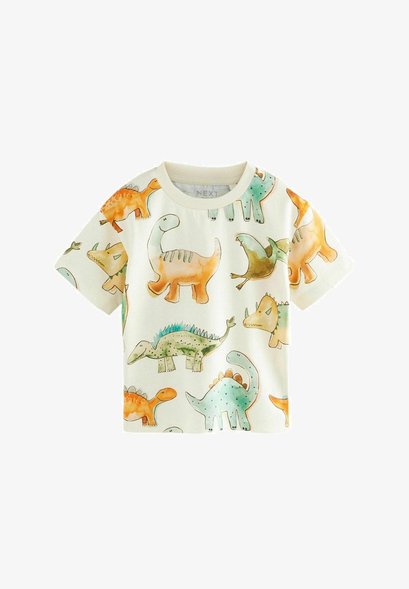 Krátky rukáv tričko v smotanovej farbe s farebnými vzormi dinosaurov. Vyrobené z mäkkej tkaniny, s okrúhlym výstrihom a voľným strihom.