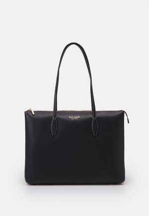 Bolso tote de cuero negro con doble asa para el hombro, cierre de cremallera y pequeño logo "kate spade new york" en el centro frontal.