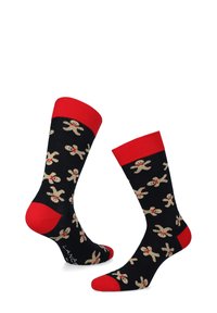 Czarne skarpetki z czerwonymi mankietami i palcami, ozdobione wzorem w postaci ludzików piernikowych w beżu z czerwonymi akcentami. Wykonane z miękkiego, elastycznego materiału dla wygody.