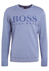 Blue sweatshirt made from cotton blend, featuring a round neckline, long sleeves, and large "BOSS HUGO BOSS" logo in darker blue across the front.