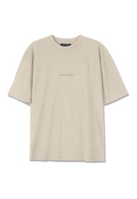 Beige bomull t-skjorte med korte ermer, rund hals og en subtil preget "PEGADOR"-logo på forsiden. Glatt tekstur.