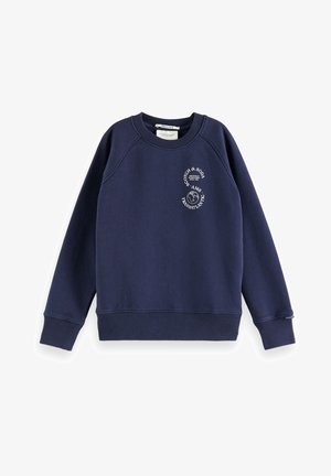 Marineblå langærmet sweatshirt med rund hals, hvidt rundt logo på venstre bryst, der viser teksten "Scotch & Soda AMS Transatlantic."