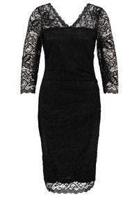 Robe en dentelle noire avec un décolleté en V et des manches trois-quarts. Silhouette ajustée avec un ourlet festonné et un motif floral en dentelle sur l'ensemble.