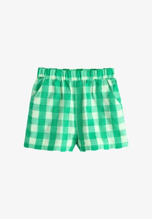 Grün-weiß karierte Shorts mit elastischem Bund und seitlichen Taschen, flach auf einem weißen Hintergrund liegend dargestellt.