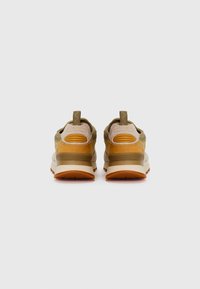 Sneakers with a mix of beige, olive green, and brown materials. Textured suede and smooth leather details. Rubber sole with traction patterns.
