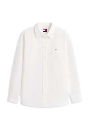 Biała koszula na długi rękaw z kołnierzykiem i guzikami, z małym logo Tommy Hilfiger na lewej piersi oraz metką wewnątrz.