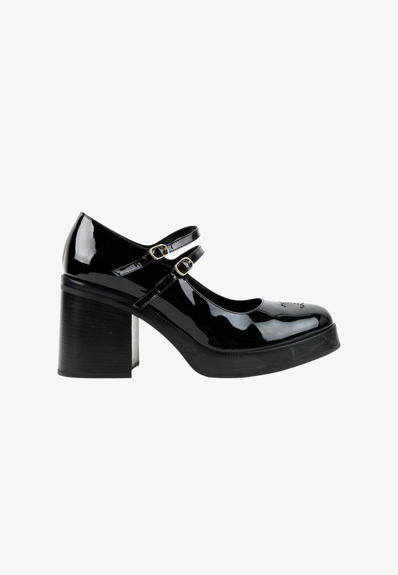 Chaussure Mary Jane en cuir verni noir avec doubles brides à boucle et talon épais, vue de côté sur fond blanc.