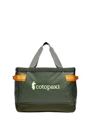 Dark green Cotopaxi tote bag with gray handles and orange side straps, featuring a llama logo and brand name on the front.