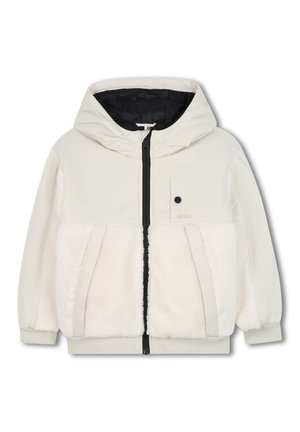 Hooded jacket in cream, featuring a plush white fleece front, black zipper, and black inner lining. Includes a small logo detail on chest.