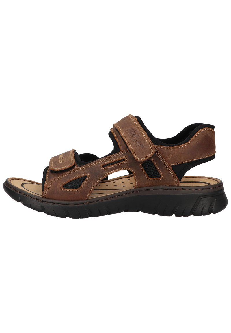Brown leather sandal with black mesh accents, adjustable velcro straps, cushioned insole, and rubber outsole featuring a textured design.