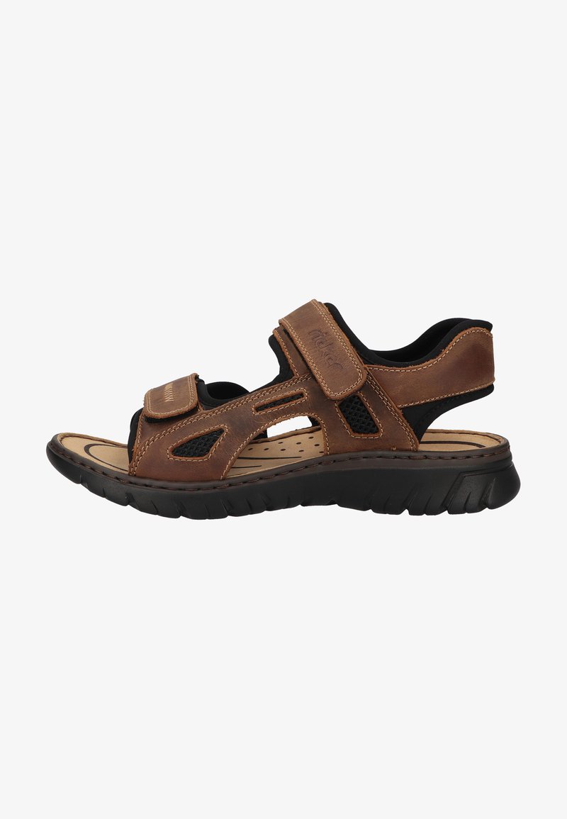 Brown leather sandal with black mesh accents, adjustable velcro straps, cushioned insole, and rubber outsole featuring a textured design.