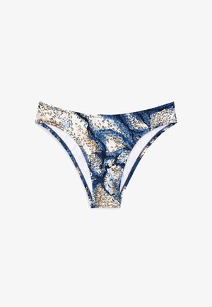 Dół bikini do pływania w wirującym niebieskim, kremowym i granatowym wzorze. Materiał ma gładką teksturę z białą podszewką i wąskimi bocznymi paskami.