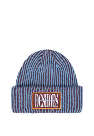 Knitted beanie with vertical blue and brown stripes, featuring a folded cuff with a rectangular patch labeled DC SHOES in white letters.