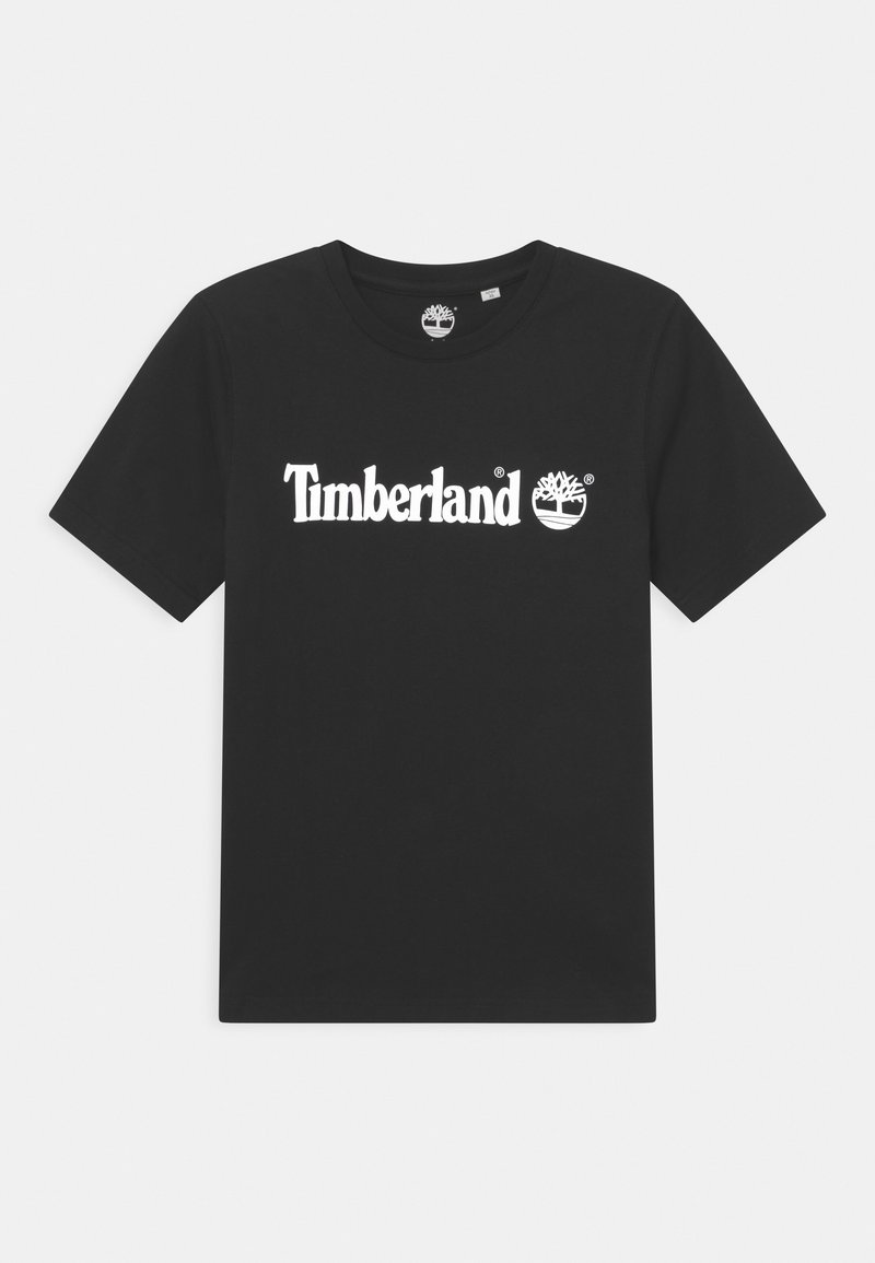 Camiseta de algodón negra con un logo blanco de "Timberland" y un icono de árbol en el pecho. Cuello redondo clásico y mangas cortas.