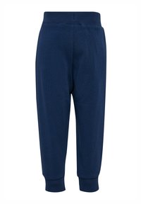 Granatowe bawełniane spodnie dresowe z żebrowanym elastycznym paskiem w talii i mankietami, o gładkiej fakturze i luźnym kroju.