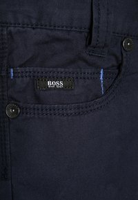 BOSS Kidswear Tygbyxor - marine