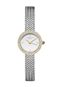 Montre en maillage argenté avec un cadran rond blanc, une lunette en or embellie de cristaux, et des aiguilles en ton or. Marque : Rosefield.
