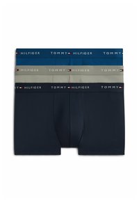 Three pairs of Tommy Hilfiger men's boxer briefs in navy, gray, and blue, each with a branded waistband featuring the logo and flag.
