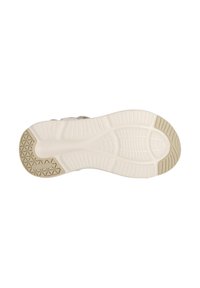 Sula på en sneaker; gummi med strukturerat mönster, främst vit med ljus beige detaljer. Har spår för bättre grepp.