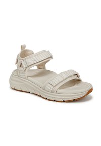 Lichtbeige sandalen met brede, gestructureerde banden voorzien van multikleuren strepen. De zool is dik en gevoerd met rubberen accenten.