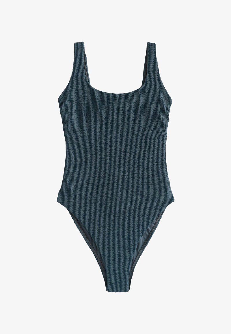 Maillot de bain une pièce texturé couleur sarcelle foncée avec larges bretelles et encolure dégagée, présenté sur un fond blanc.