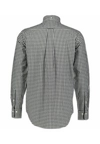 Overhemd met lange mouwen en kraag in zwart-wit ruitpatroon, met knoopmanchetten en een plooi aan de achterkant voor een comfortabele pasvorm.