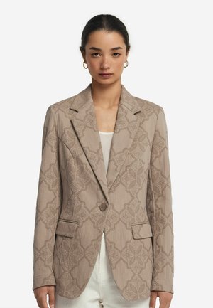Beige strukturierter Blazer mit einem dezenten Blumenmuster, einreihiger Knopfverschluss, Reverskragen und zwei vorderen Taschen.