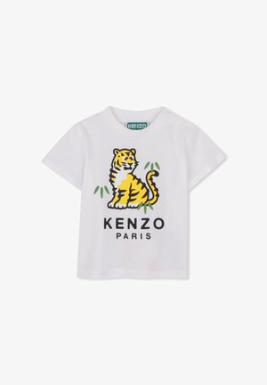 T-shirt bianca in cotone con grafica colorata di una tigre e scritta "KENZO PARIS" in lettere nere in grassetto. Girocollo con bottoni a pressione.