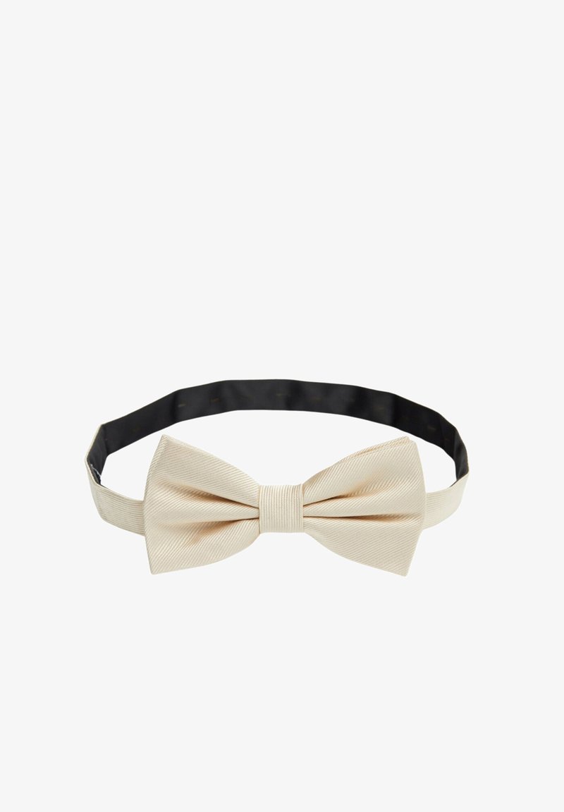 Beige silkeslips med en texturerad yta och platt form, fäst vid ett svart justerbart band för säker användning.