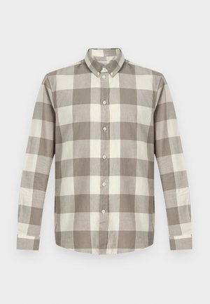 Long-sleeve button-up shirt with beige and white large checkered pattern and a pointed collar against a plain background.