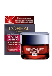 Bocal en verre rouge avec un couvercle en métal argenté étiqueté "Revitalift Laser X3". Boîte noire à l'arrière avec des accents rouges et un texte doré, indiquant les bienfaits anti-âge.