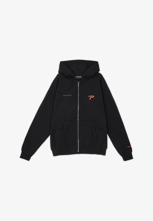 Schwarze Zip-Hoodie aus einem Baumwollmischgewebe mit Kängurutasche. Mit orangenen Logoakzenten auf der Brust und dem Ärmel.
