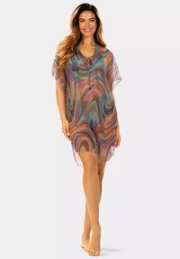 Wielokolorowa przezroczysta narzutka plażowa z falistym wzorem, okrągłym dekoltem, krótkimi rękawami oraz dekoracyjnym detalem przy dekolcie.