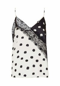Camisole noir et blanc à pois avec des bordures en dentelle. Dotée de bretelles réglables et d'un design géométrique avec des sections contrastées. Tissu semblable à de la soie.