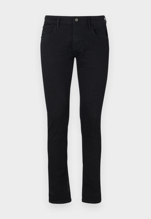 Jeans neri slim-fit in materiale denim con una texture liscia. Presentano cinque tasche e una chiusura con zip e bottone in vita.