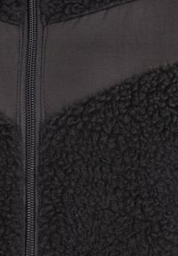 Schmuddelwedda Forro polar - schwarz