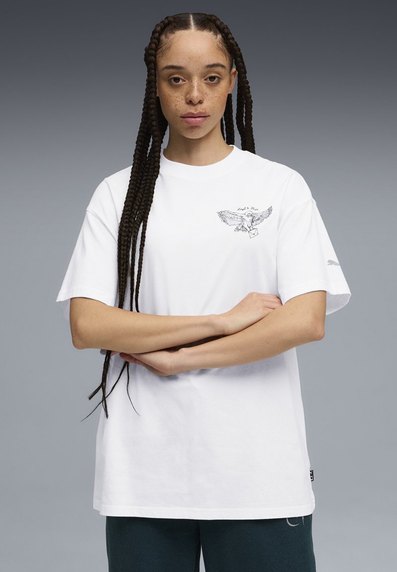White cotton T-shirt with short sleeves, featuring a black eagle graphic on the left chest and a small logo on the sleeve.